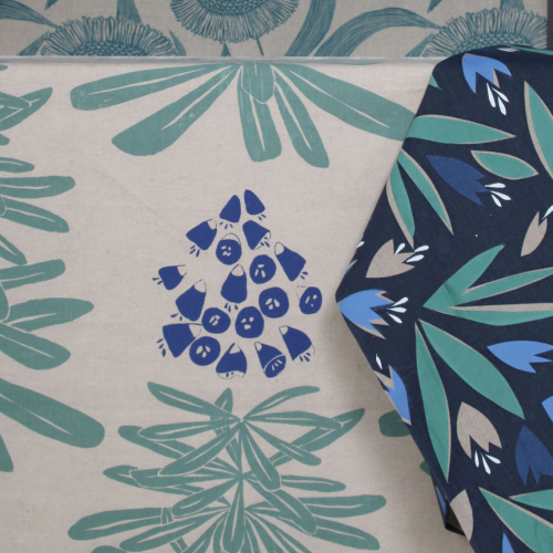 Hand printed floral fabric in green and blue.