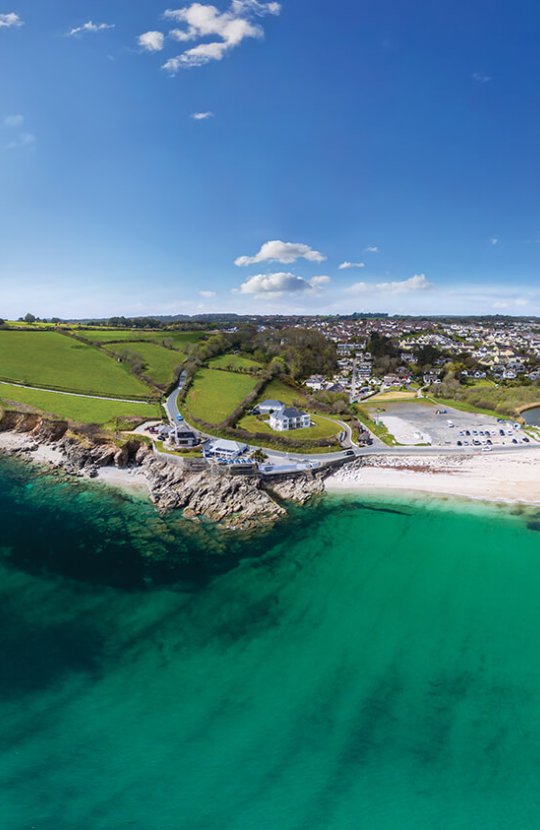 Aerial View Of Swanpool Beach with sea and cliffs