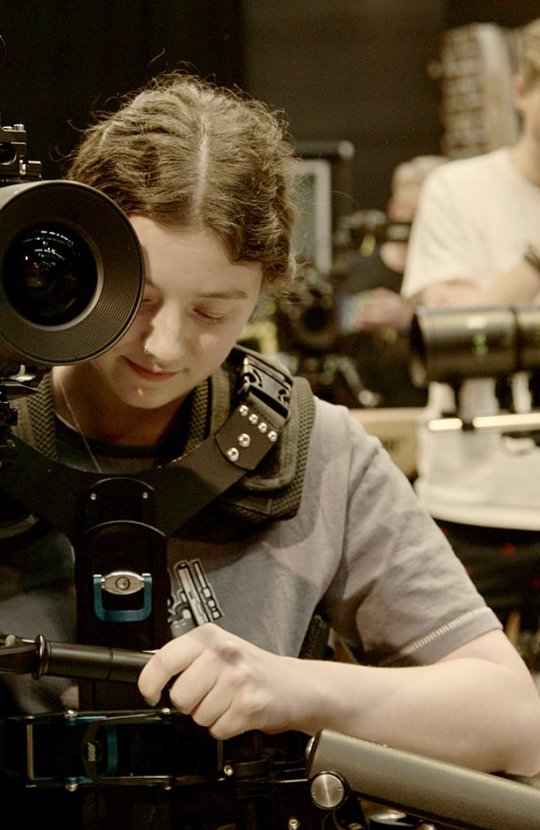 A female student operating an ARRI camera at Falmouth University