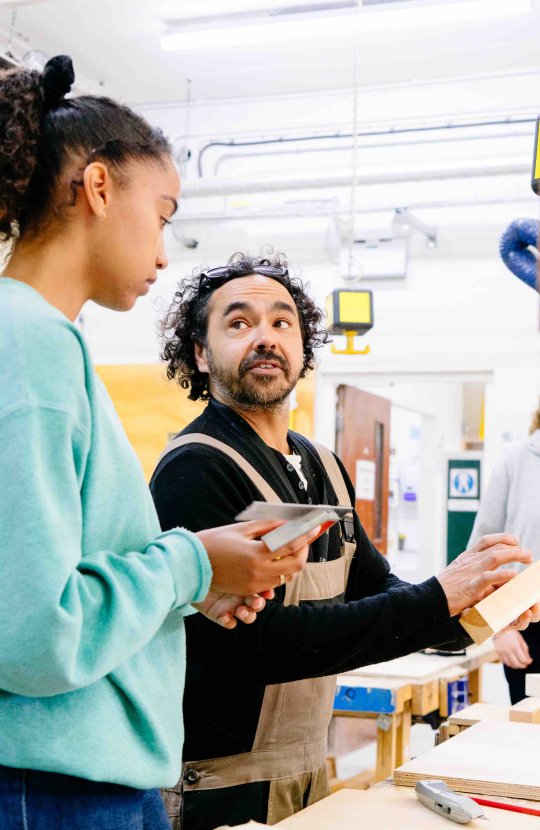 Student and tutor in product design workshop